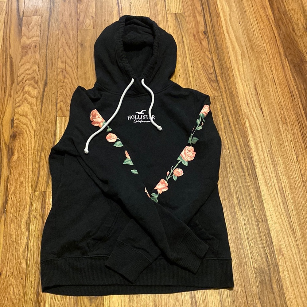 Hollister black hoodie with roses on sleeve